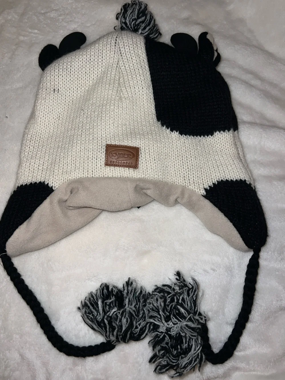 Kyber outerwear Kids Cow Earflap Hat - Black, White & Pink